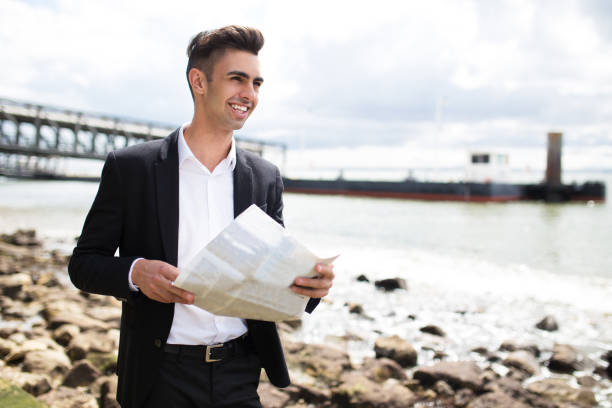 istock Happy purposeful businessman reading newspaper 861814492