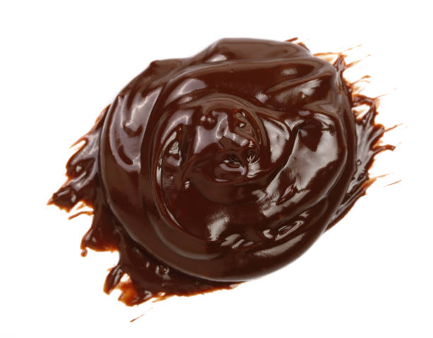 istock Hot melted chocolate pouring isolated on white background, top view 861841444