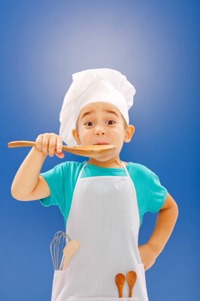 istock Little chef tasting food 861843878
