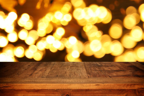 istock Empty table in front of black and gold glitter lights background 861847146