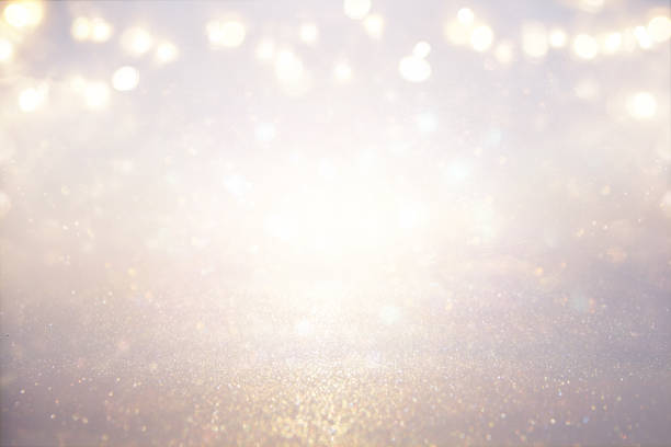 istock glitter vintage lights background. silver and light gold. de-focused 861847148