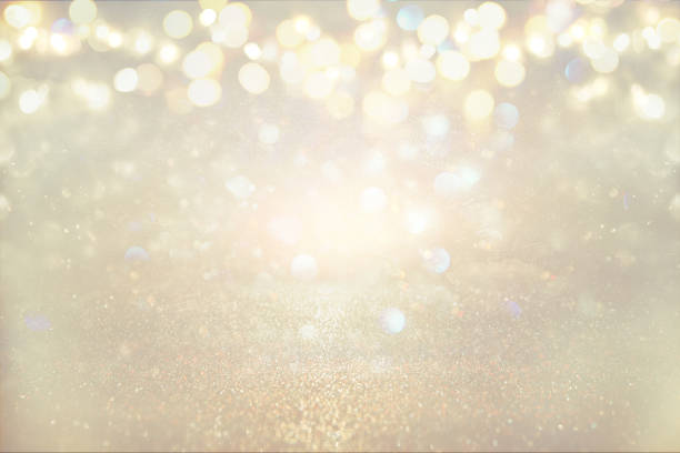 istock glitter vintage lights background. silver and light gold. de-focused 861847164