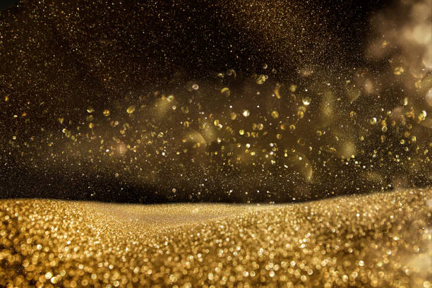 istock glitter vintage lights background. gold and black. de focused 861847202