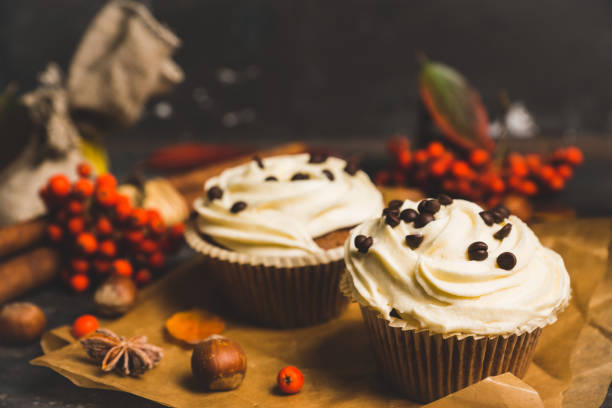 istock Cupcakes with autumn decorations on the rustic wooden background 861850044