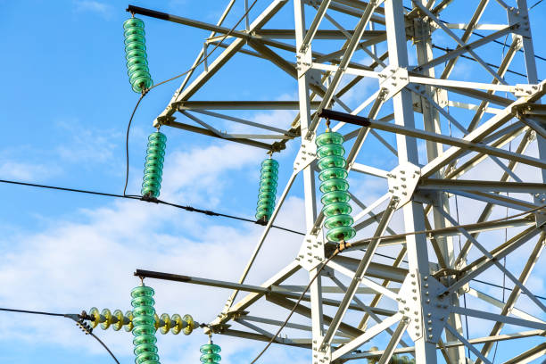 High voltage electric tower against the blue sky. Power transmission line