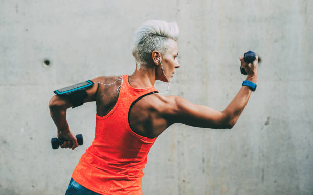istock Middle-aged woman training with dumbbells 861853202