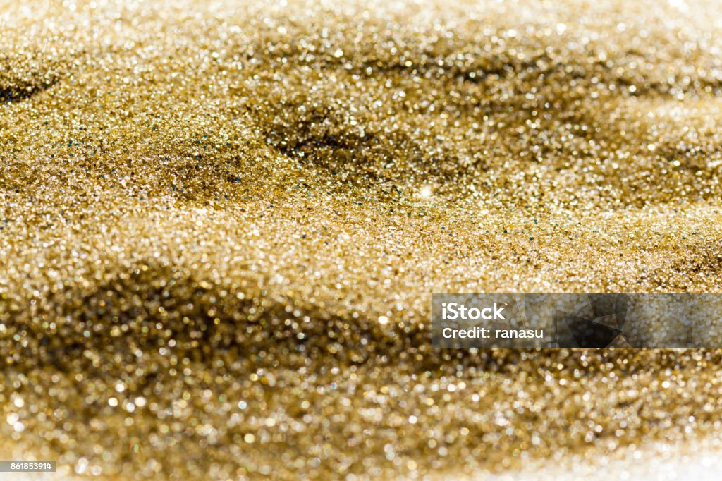 Golden glitter background Defocused Background Sand Stock Photo