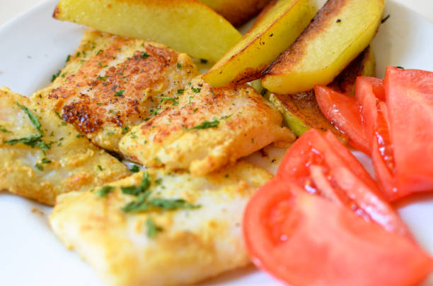 istock Roasted pangasius fish with potatoes 861854558