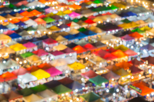 istock Roof top blurred bokeh multiple colour night market 861855176