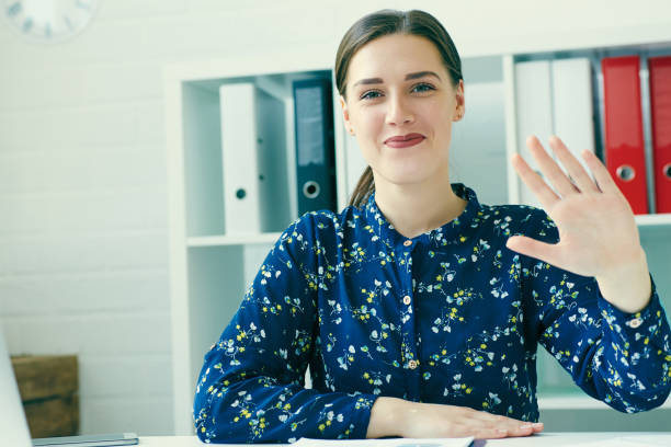 istock Female secretary says hello with hand. 861862158