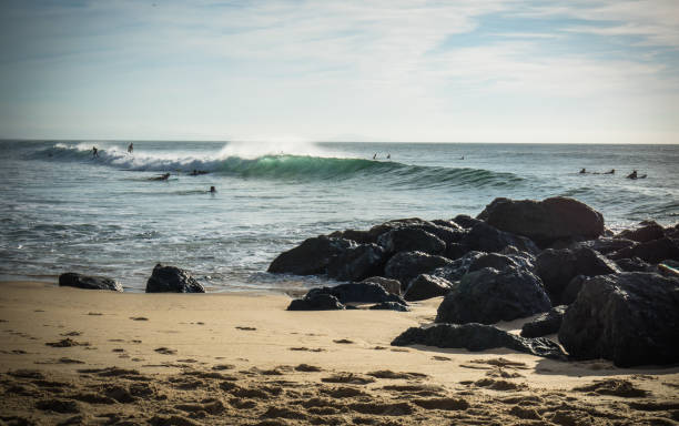 istock surfers catching powerful waves on atlantic ocean with breaking waves in blue sky 861862726