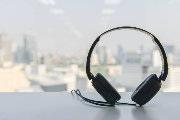 istock Black headphone is on the white table 861862750