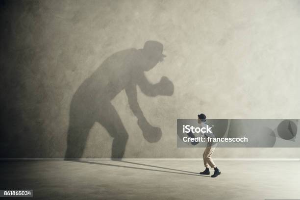 Man Fighting With His Shadow Facing Fears Stock Photo - Download Image Now - Boxing - Sport, Fear, Rivalry