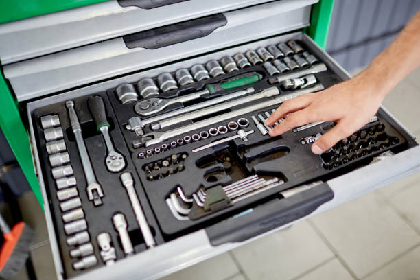 istock Hand on the background of a box with tools 861865388