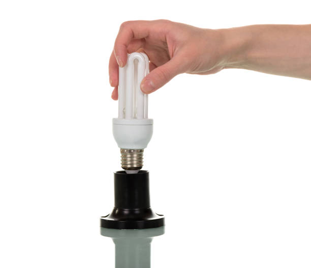 istock In female hand compact fluorescent light bulb, the cartridge is isolated on white background. 861865406