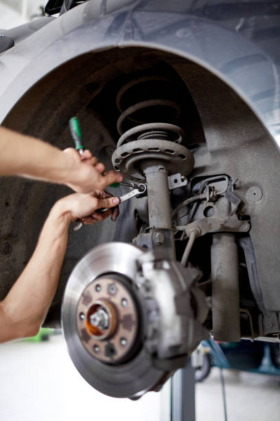 istock An unidentified mechanic repairing brake pads with tools 861865878
