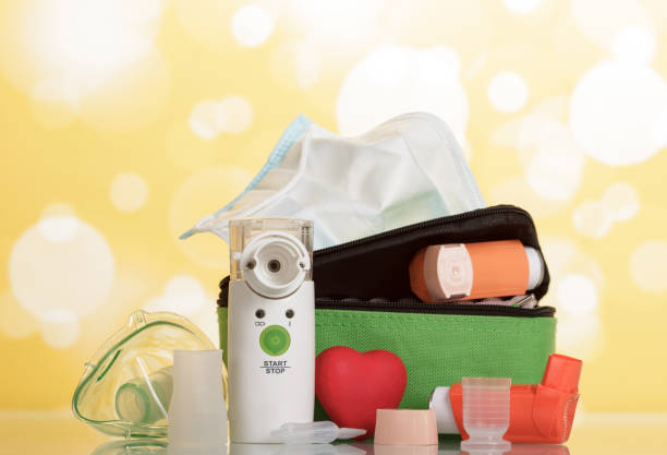 istock Electronic mesh inhaler with mask and other devices on yellow 861868400