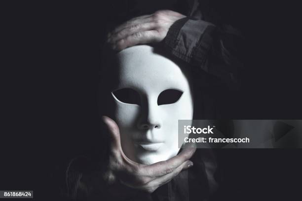 Hands Holding White Mask Stock Photo - Download Image Now - Mask - Disguise, Men, Theatrical Performance