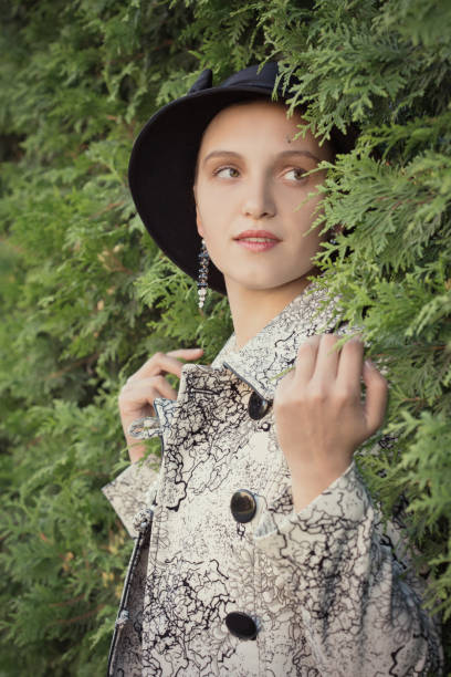 istock woman near green hedge 861868506