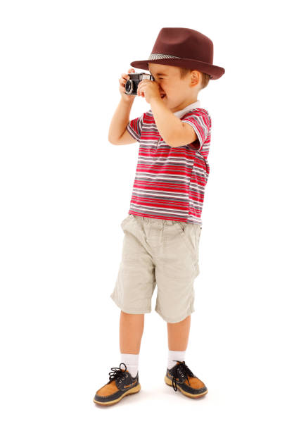 istock Little boy in hat, taking photos 861871654