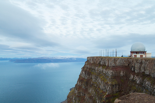BOLUNGARVIK, ICELAND - SEPTEMBER 2017: Latrar Air Station is an abandoned US Air Force General Surveillance Radar station at the top of Bolafjall above the town of Bolungarvik in the Westfjords of Iceland. View over Hornstrandir Nature Reserve Park . Latrar Air Station was established in 1992 to replace the US Air Force radar base Straumnes Air Station (built in 1956).