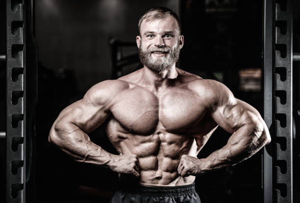 istock Handsome fit caucasian muscular man flexing his muscles in gym 861880246