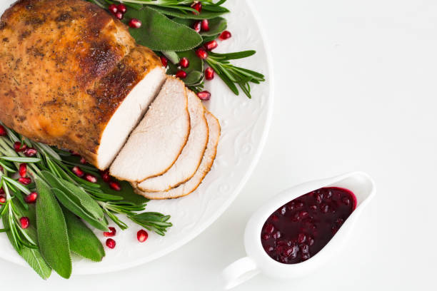 istock roasted  turkey breast with spicy herbs and cranberry sauce, 861880528