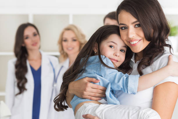 istock Mother and daughter in clinic 861883410