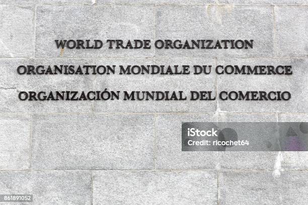 World Trade Organisation Text On A Wall Stock Photo - Download Image Now - World Trade Organization, Logo, Organization