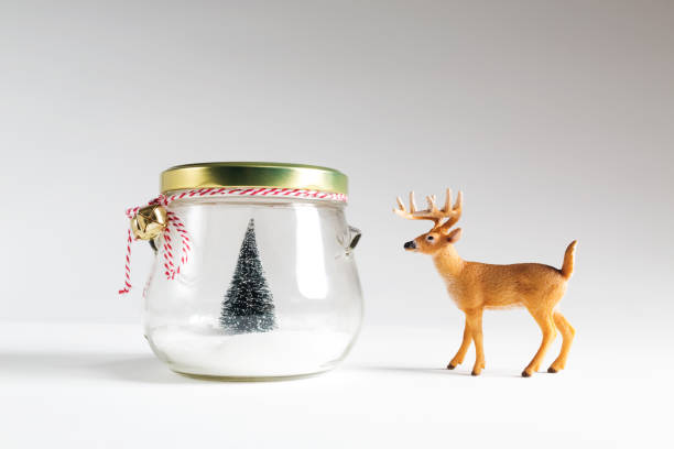 istock Small Christmas tree in a jar with a reindeer 861892064