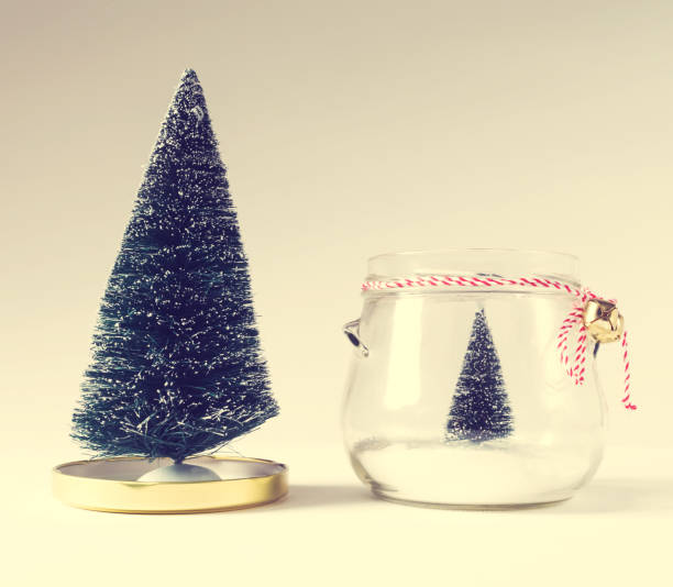 istock Christmas trees with one in a glass jar 861892114