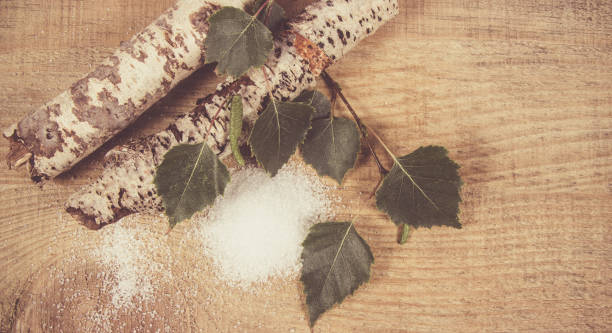 istock Xylitol - sugar substitute. Birch sugar on wooden background. 861899442