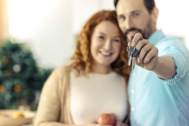 istock Delighted family holding keys to a new flat 861900028