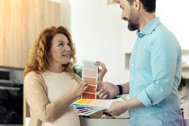 istock Optimistic family choosing the color design for a new flat 861902620