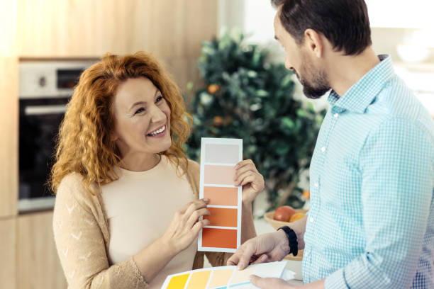 istock Adorable family choosing suitable colors for new design 861903932