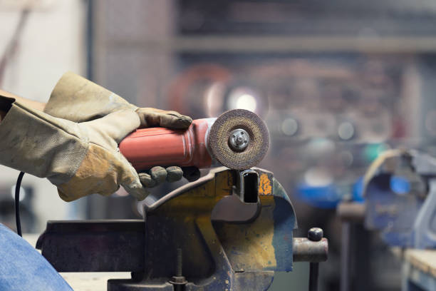 istock Hands of Engineer cutting steel pipe with sparking cutter. 861910186