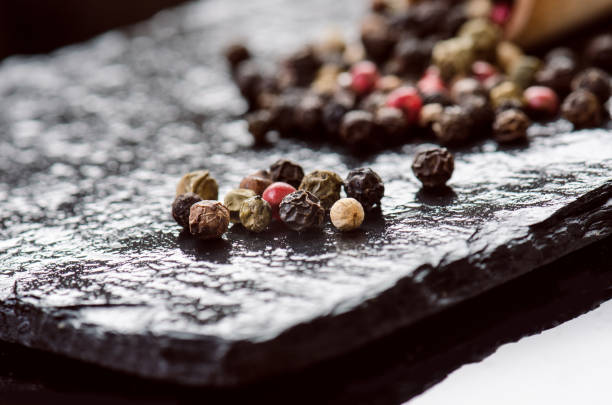 istock Different spices and herbs on a black slate. Iron spoon with chili pepper. Indian spices. Ingredients for cooking. Healthy eating concept. Various spices on dark background. 861910866
