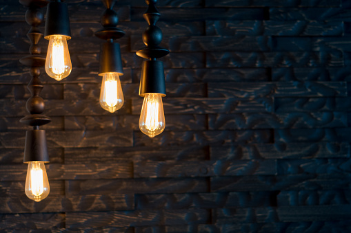 Rustic design, brick wall with light bulbs and pipes