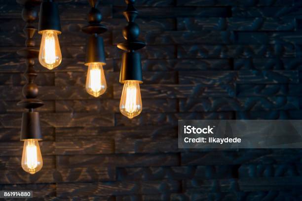 Rustic Design Brick Wall With Light Bulbs And Pipes Stock Photo - Download Image Now