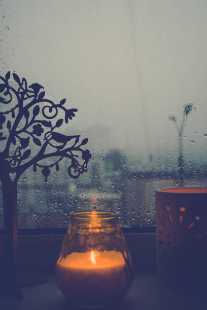 istock candle on a rainy autumn evening window 861915430