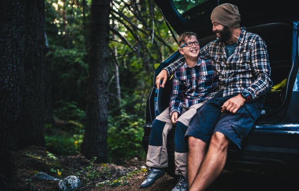 istock Father and son travelling by car 861918318