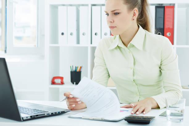 istock Beautiful young secretary make notes looking at  laptop sitting at office. Business, exchange market, job offer, analytics research, excellent education, certified public accountant concept 861919372