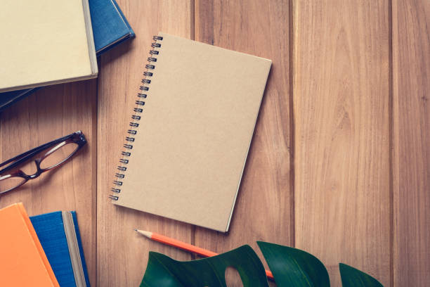 istock top view book and pencil note on wood table 861919752