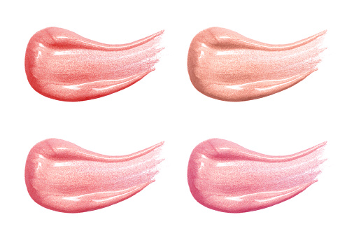Conjunto de labios diferentes lustres muestras de frotis de color pastel aisladas en blanco. Producto de maquillaje manchado photo