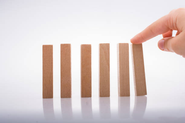istock Hand holding wooden domino 861929180