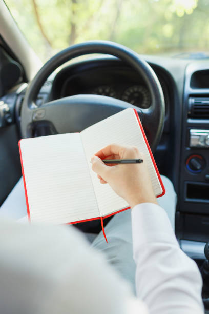 istock Attractive handsome elegant man in a business suit driving an expensive car. 861931654
