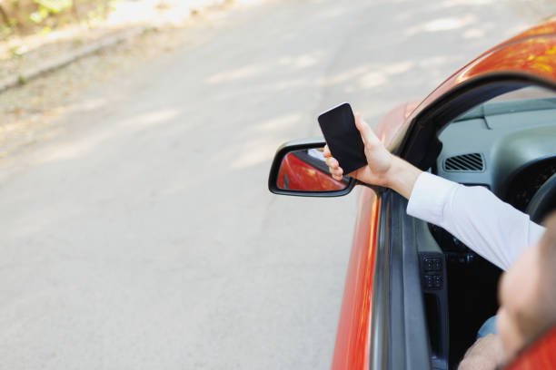 istock Attractive handsome elegant man in a business suit driving an expensive car. 861931742