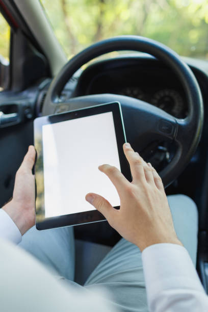 istock Attractive handsome elegant man in a business suit driving an expensive car. 861931788