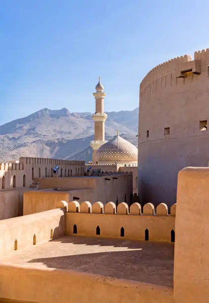 The Grand mosque and minaret in Nizwa viewed from the Nizwa fortress in Oman.