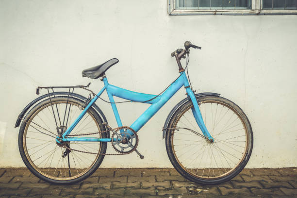 istock bicycle leaning against an old plaster wall home 861939168